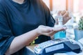 Young woman uses her hand to press hand sanitizer bottle to clean her hand. Hand sanitizer alcohol gel rub clean hands hygiene Royalty Free Stock Photo