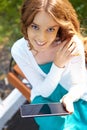 Young woman uses tablet pc. Royalty Free Stock Photo