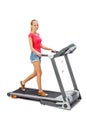 Young woman uses treadmill.