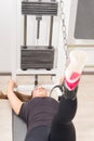 Young woman using cable crossover machine at gym Royalty Free Stock Photo