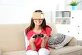 Young woman using cardboard virtual reality headset Royalty Free Stock Photo