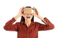 Young woman using cardboard virtual reality headset Royalty Free Stock Photo
