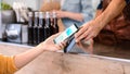 Young Woman is Using Contactless NFC Payment App Installed on Her Smartphone to Pay for Gourme Str Royalty Free Stock Photo