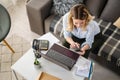 A young woman using a credit card at home to make a purchase or payment over the internet Royalty Free Stock Photo