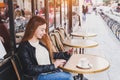 Woman using digital tablet computer in street cafe Royalty Free Stock Photo