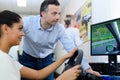 Young woman using driving simulator Royalty Free Stock Photo