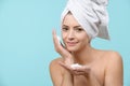 Young woman using gentle foam facial cleanser. Attractive woman washing her face with foam soap. Royalty Free Stock Photo