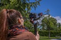 Young woman using a gimbal camera stabilizer