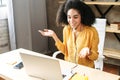 Young woman is using handfree headset