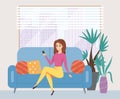 Young woman using her phone while sitting on the couch. Female character takes a selfie at home