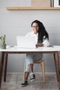 Young woman using laptop computer at office. Student girl working at home. Work or study from home, freelance, lifestyle concept Royalty Free Stock Photo