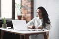 Young woman using laptop computer at office. Student girl working at home. Work or study from home Royalty Free Stock Photo