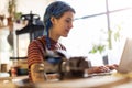 Young woman using laptop in her workshop Royalty Free Stock Photo