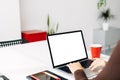 Young woman using laptop with mock up white blank screen at home office Royalty Free Stock Photo