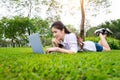 Young woman using laptop in park Royalty Free Stock Photo