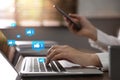 Young woman using laptop and smartphone indoors, closeup. Social media Royalty Free Stock Photo