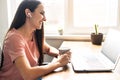 A young woman using laptop for video call, zoom Royalty Free Stock Photo