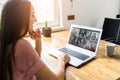 A young woman using laptop for video call, zoom Royalty Free Stock Photo