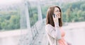 Young woman using mobile phone outdoors in a city Royalty Free Stock Photo