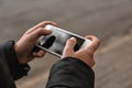 Young woman using mobile phone outdoors, closeup Royalty Free Stock Photo