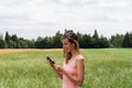 Young woman using mobile phone on a walk