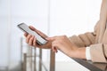 Young woman using modern smartphone indoors, closeup Royalty Free Stock Photo