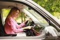 Young woman using navigation system while driving car Royalty Free Stock Photo