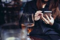 Young woman using smart phone at bar Royalty Free Stock Photo