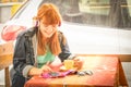 Young woman using smartphone and drinking cappuccino coffee Royalty Free Stock Photo