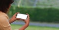 Young woman using smartphone at home. Student girl texting on mobile phone in her room. Royalty Free Stock Photo