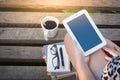 Young woman using smartphone in park Royalty Free Stock Photo