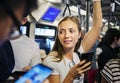 Young woman using a smartphone in the subway Royalty Free Stock Photo