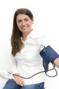 Young woman using a sphygmomanometer Royalty Free Stock Photo