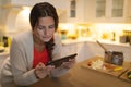 Young woman using tablet computer at home Royalty Free Stock Photo