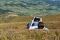 Young woman using tablet computer outdoors Royalty Free Stock Photo