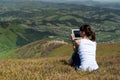 Young woman using tablet computer outdoors Royalty Free Stock Photo