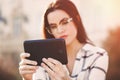 Young woman using tablet outdoor Royalty Free Stock Photo