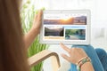 Young woman using tablet to plan trip. Travel agency website Royalty Free Stock Photo