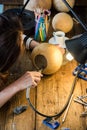 Young woman using tools for creative craft