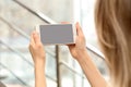 Young woman using video chat on smartphone indoors in blurred background. Royalty Free Stock Photo