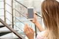 Young woman using video chat on smartphone indoors Royalty Free Stock Photo