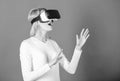 Young woman using a virtual reality headset with conceptual network lines. Woman using VR device. Cheerful smiling woman Royalty Free Stock Photo