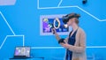 Young woman using virtual reality headset and drawing with special joystick Royalty Free Stock Photo