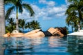 Young woman on vacation at hawaii, sexy girl at the swimming pool. Bikini model at the infinity pool. Royalty Free Stock Photo