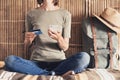 Young woman on vacations using smartphone and credit card. Online shopping and travel concept Royalty Free Stock Photo