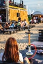 Young woman vaping outdoors. Woman with hookah.