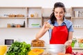 Young woman with vegetables in the kitchen Royalty Free Stock Photo