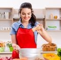 Young woman with vegetables in the kitchen Royalty Free Stock Photo