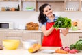 The young woman with vegetables in the kitchen Royalty Free Stock Photo