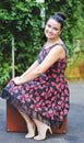 Young woman in vintage skirt with and old suitcase Royalty Free Stock Photo